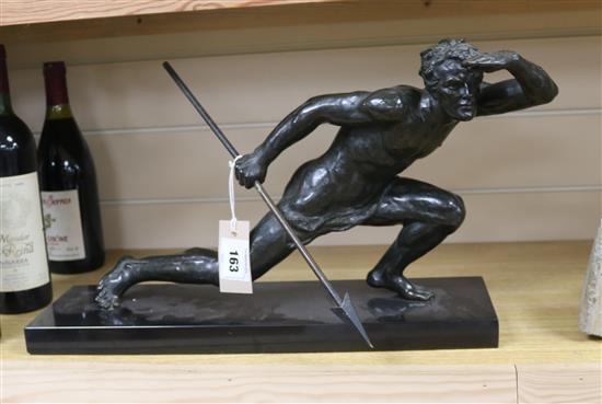 A 1930s French bronze figure of a hunter holding a spear, width 20in.